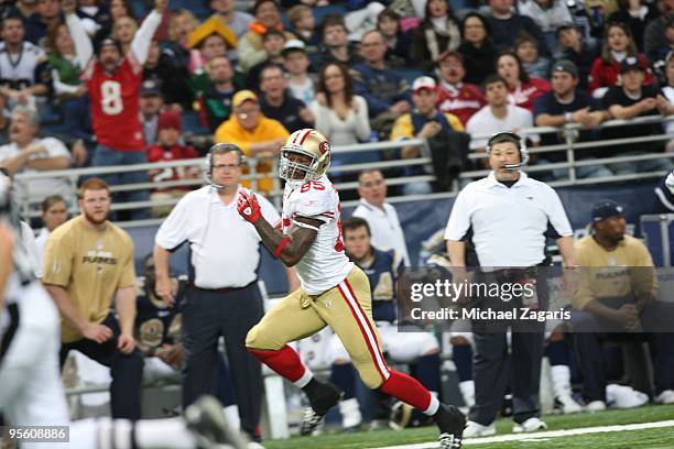 Vernon Davis of the San Francisco 49ers runs the ball for a touchdown tying the NFL record for tight ends during the NFL game against the St. Louis...