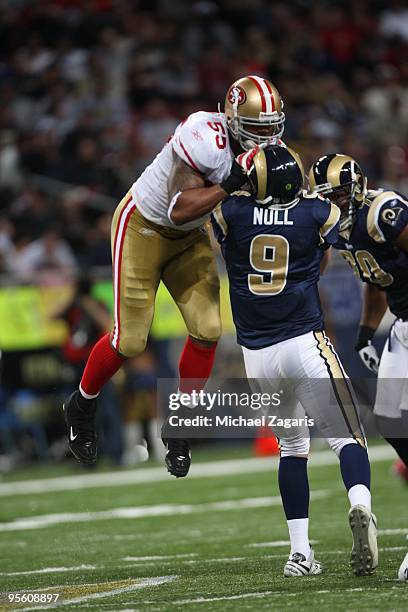 Ahmad Brooks of the San Francisco 49ers rushes Keith Null of the St. Louis Rams during the NFL game at Edward Jones Dome on January 3, 2010 in St....