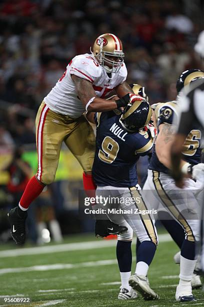 Ahmad Brooks of the San Francisco 49ers rushes Keith Null of the St. Louis Rams during the NFL game at Edward Jones Dome on January 3, 2010 in St....