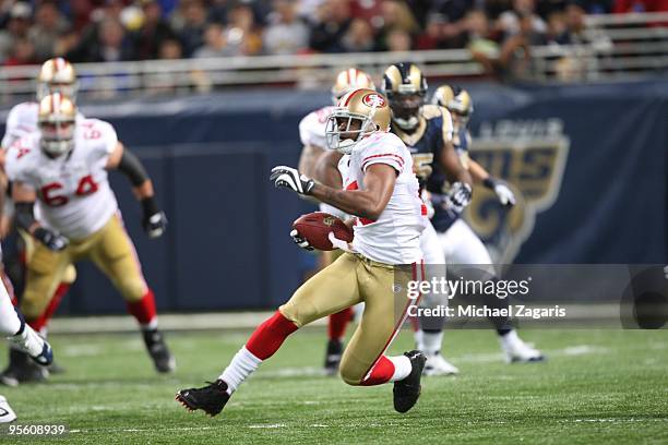 Michael Crabtree of the San Francisco 49ers runs the ball after making a reception during the NFL game against the St. Louis Rams at Edward Jones...