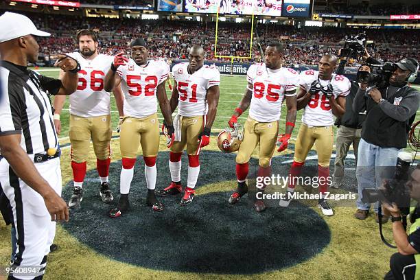 Isaac Bruce of the San Francisco 49ers and team captains during the coin toss prior to the NFL game against the St. Louis Rams at Edward Jones Dome...