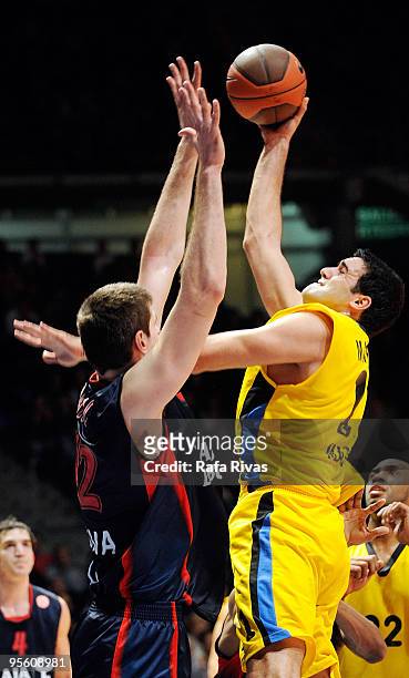 Dimitrios Mavroeidis, #11 of Maroussi BC competes with Stanko Barac, #42 of Caja Laboral in action during the Euroleague Basketball Regular Season...