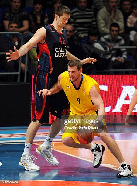 Jared Homan, #9 of Maroussi BC competes with Stanko Barac, #42 of Caja Laboral during the Euroleague Basketball Regular Season 2009-2010 Game Day 9...