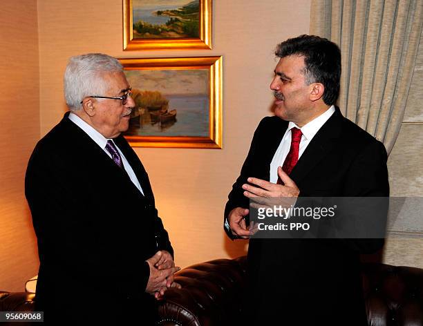 In this handout image supplied by the Palestinian Press Office , Palestinian President Mahmoud Abbas speaks with the Foreign Minister of Turkey Ahmet...
