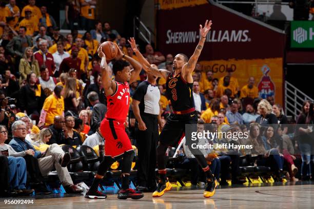 George Hill of the Cleveland Cavaliers plays defense against Kyle Lowry of the Toronto Raptors during Game Four of the Eastern Conference Semifinals...