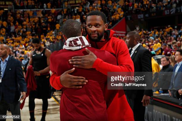 Miles of the Toronto Raptors hugs George Hill of the Cleveland Cavaliers after Game Four of the Eastern Conference Semifinals of the 2018 NBA...