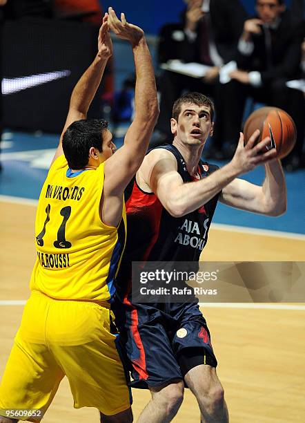 Stanko Barac, #42 of Caja Laboral competes with Dimitrios Mavroeidis, #11 of Maroussi BC during the Euroleague Basketball Regular Season 2009-2010...