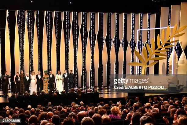 French actor and Master of Ceremony Edouard Baer poses on stage on May 8, 2018 with Australian actress and President of the Jury Cate Blanchett, US...