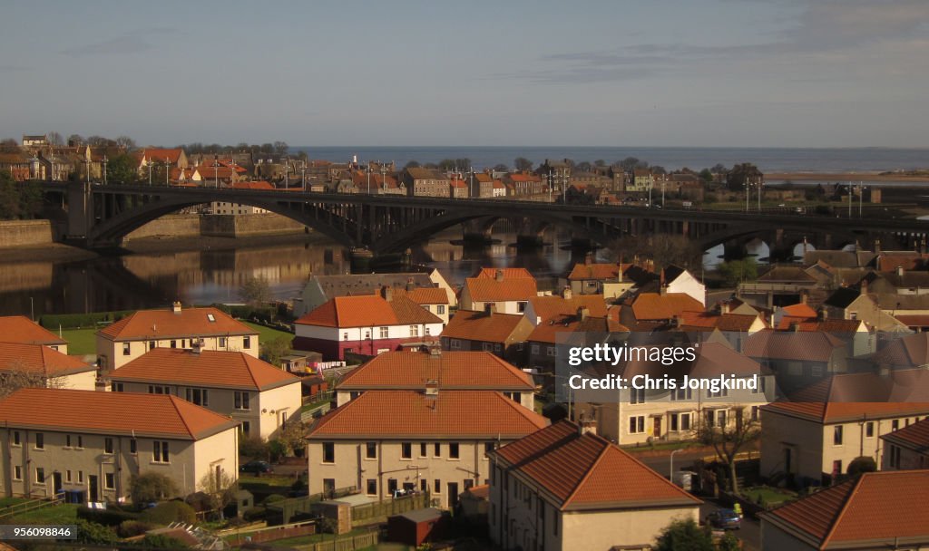 Bridge over River surrounded by Houses