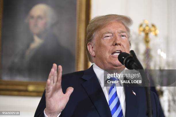 President Donald Trump announces his decision on the Iran nuclear deal in the Diplomatic Reception Room at the White House in Washington, DC, on May...