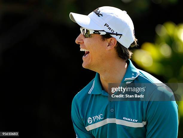 Parker McLachlin smiles from the first tee box during practice for the SBS Championship at Plantation Course at Kapalua on January 6, 2010 in...