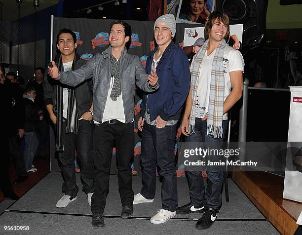 Actors Carlos Pena,Logan Henderson,Kendall Schmidt and James Maslow visit Planet Hollywood Times Square on January 6, 2010 in New York City.