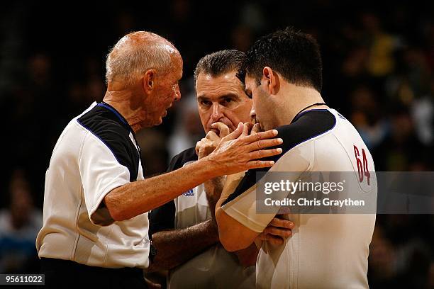 Referees Dick Bavetta, Joe Forte and Eli Roe talk during a time out in the game between the New Orleans Hornets and the Miami Heat at New Orleans...
