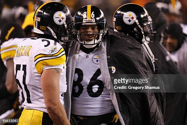 Hines Ward and James Farrior of the Pittsburgh Steelers stand on the sideline during the game against the Cleveland Browns on December 10, 2009 at...