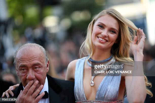 Ducth model Romee Strijd and the president, owner and founder of de GRISOGONO Fawaz Gruosi pose as they arrive on May 8, 2018 for the screening of...