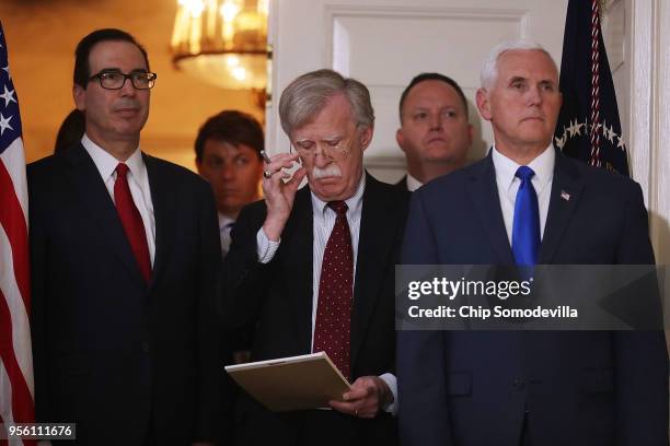 Treasury Secretary Steven Mnuchin , White House National Security Advisor John Bolton and Vice President Mike Pence listen to President Donald Trump...