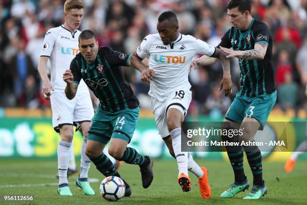 Jordan Ayew of Swansea City and Oriol Romeu of Southampton during the Premier League match between Swansea City and Southampton at Liberty Stadium on...