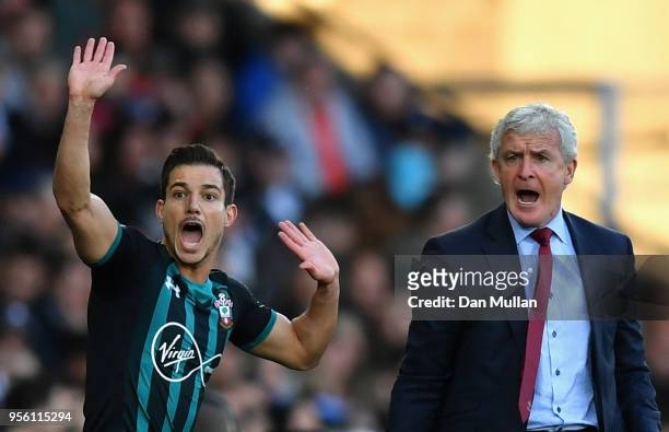 Mark Hughes, Manager of Southampton and Cedric Soares of Southampton react during the Premier League match between Swansea City and Southampton at...