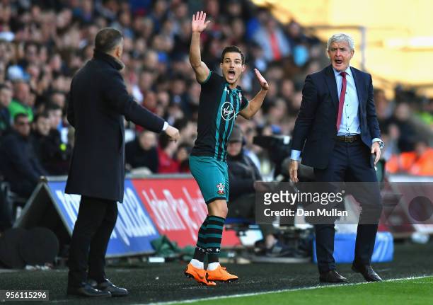 Mark Hughes, Manager of Southampton and Cedric Soares of Southampton react during the Premier League match between Swansea City and Southampton at...