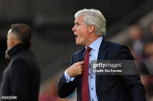 Mark Hughes, Manager of Southampton reacts during the Premier League match between Swansea City and Southampton at Liberty Stadium on May 8, 2018 in...