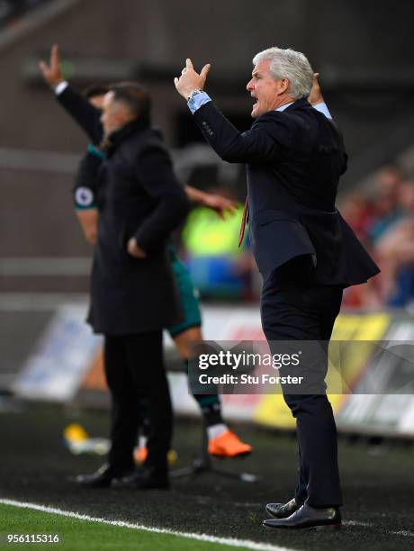 Mark Hughes, Manager of Southampton reacts during the Premier League match between Swansea City and Southampton at Liberty Stadium on May 8, 2018 in...