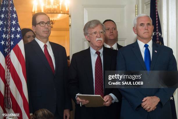 Secretary of Treasury Steven Mnuchin , National Security Advisor John Bolton and US Vice President Mike Pence listen as US President Donald Trump...