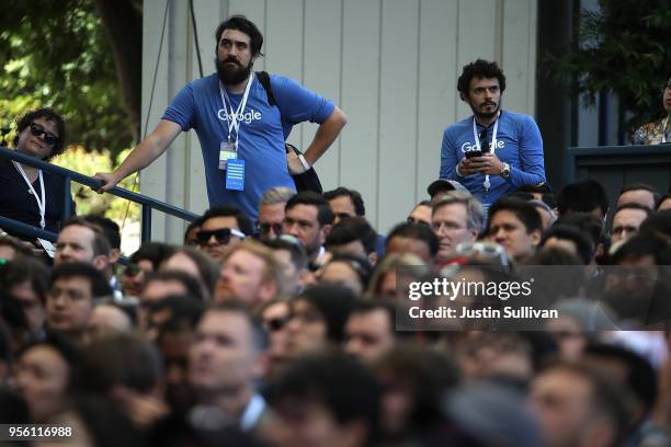 Attendees look on as Google CEO Sundar Pichai delivers the keynote address at the Google I/O 2018 Conference at Shoreline Amphitheater on May 8, 2018...