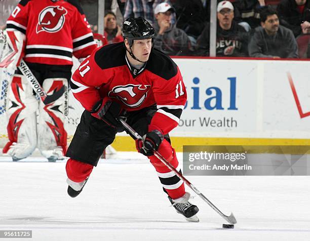 Dean McAmmond of the New Jersey Devils controls the puck against the Dallas Stars during the game at the Prudential Center on January 5, 2010 in...