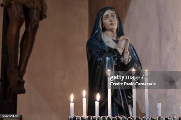 illuminated candles in the church - mary moody stockfoto's en -beelden