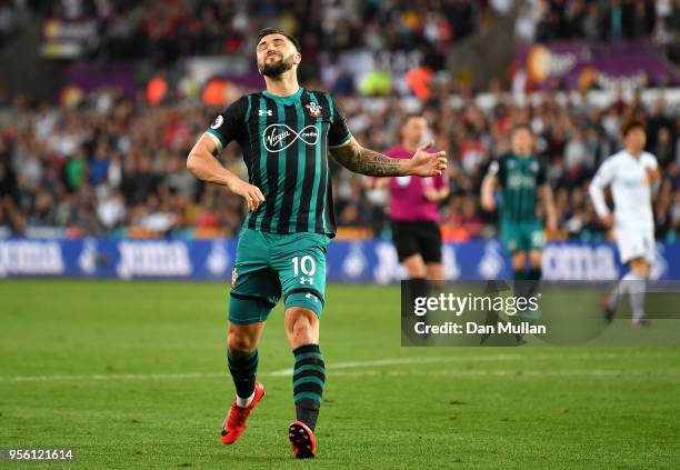 Charlie Austin of Southampton reacts after a missed chance during the Premier League match between Swansea City and Southampton at Liberty Stadium on...