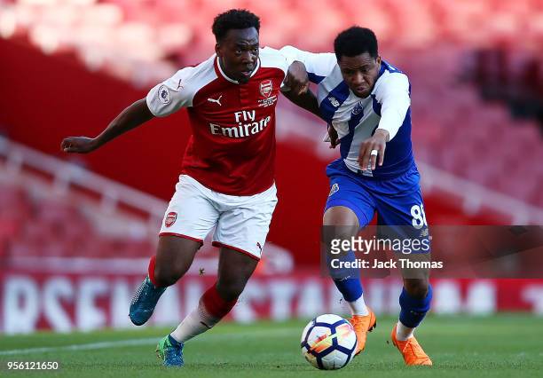 Tolaji Bola of Arsenal U/23 and Musa Yahaya of Porto U23 compete for the ball during the Premier League International Trophy between Arsenal U23 and...