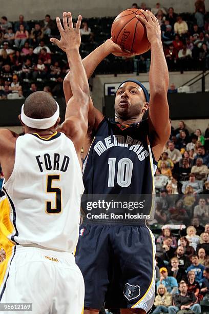 Jamaal Tinsley of the Memphis Grizzlies shoots against T.J. Ford of the Indiana Pacers during the game on December 30, 2009 at Conseco Fieldhouse in...