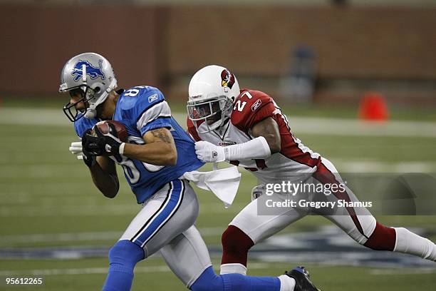 Michael Adams of the Arizona Cardinals tackles Dennis Northcutt of the Detroit Lions on December 20, 2009 at Ford Field in Detroit, Michigan.