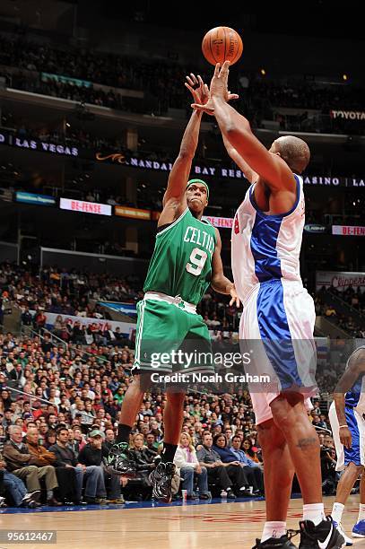 Rajon Rondo of the Boston Celtics lays up a shot against Brian Skinner of the Los Angeles Clippers during the game at Staples Center on December 27,...