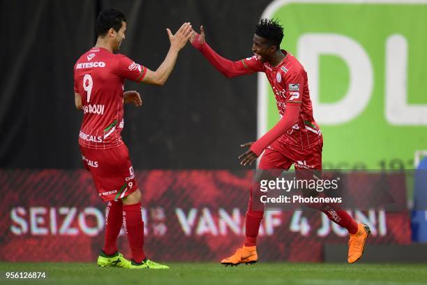 Peter Olayinka forward of SV Zulte Waregem celebrates scoring a goal with teammate Hamdi Harbaoui forward of SV Zulte Waregem during the Jupiler Pro...