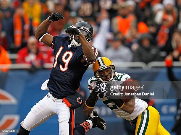 Charles Woodson of the Green Bay Packers breaks up a pass intended for Devin Aromashodu of the Chicago Bears at Soldier Field on December 13, 2009 in...