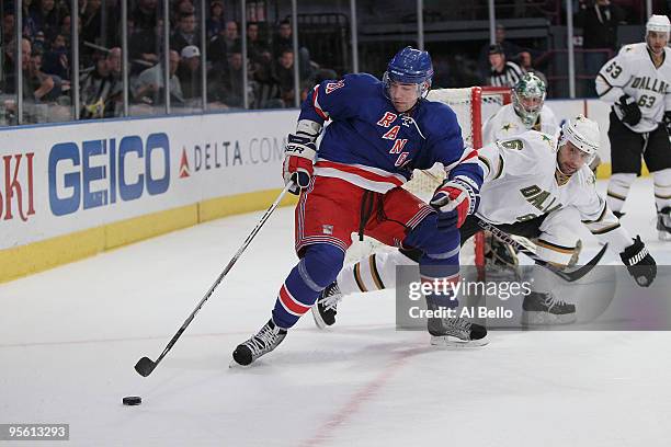 Christopher Higgins of the New York Rangers and Trevor Daley of the Dallas Stars battle for the puck during their game on January 6, 2010 at Madison...