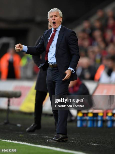 Southampton manager Mark Hughes reacts during the Premier League match between Swansea City and Southampton at Liberty Stadium on May 8, 2018 in...