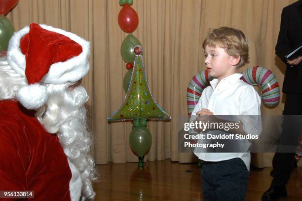 Santa Claus visits with Barron Trump, son of Donald Trump, at the Mar-A-Lago estate, Palm Beach, Florida, December 25, 2008.