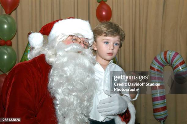 Santa Claus visits with Barron Trump, son of Donald Trump, at the Mar-A-Lago estate, Palm Beach, Florida, December 25, 2008.