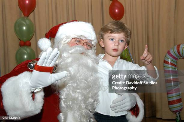 Santa Claus visits with Barron Trump, son of Donald Trump, at the Mar-A-Lago estate, Palm Beach, Florida, December 25, 2008.