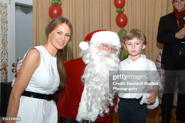 Melania Trump poses with Santa Claus and her son Barron, at the Mar-A-Lago estate, Palm Beach, Florida, December 25, 2008.