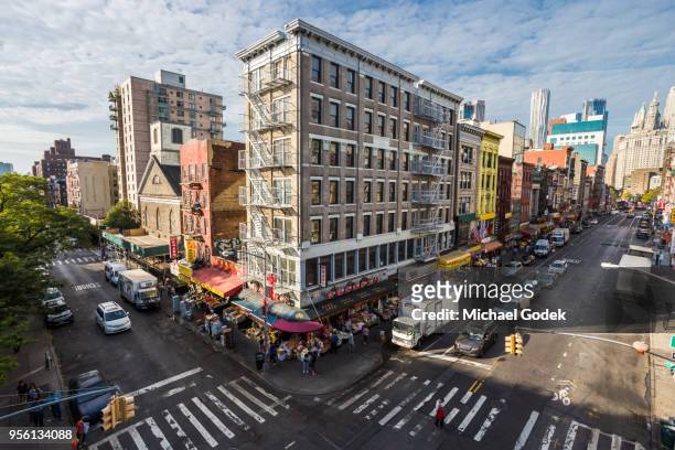 view of busy chinatown intersection from manhattan bridge - lower east side manhattan stock pictures, royalty-free photos & images