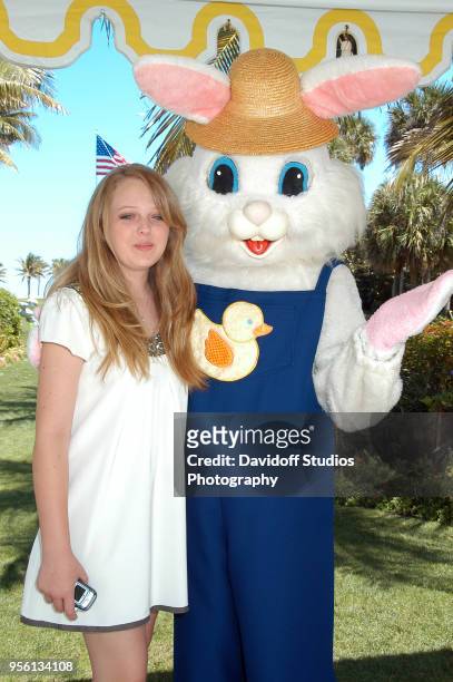 Tiffany Trump, daughter of Donald Trump and Marla Maples, stands with the Easter Bunny during Easter Sunday events at the Mar-a-Lago club in Palm...