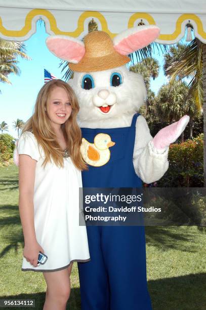 Tiffany Trump, daughter of Donald Trump and Marla Maples, stands with the Easter Bunny during Easter Sunday events at the Mar-a-Lago club in Palm...