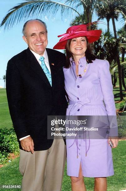 Former New York City mayor Rudy Giuliani poses with his wife Judity during Easter Sunday events at the Mar-a-Lago club in Palm Beach, Florida, April...