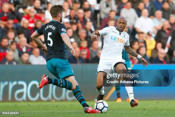 Andre Ayew of Swansea City marks Jack Stephens of Southampton during the Premier League match between Swansea City and Southampton at Liberty Stadium...