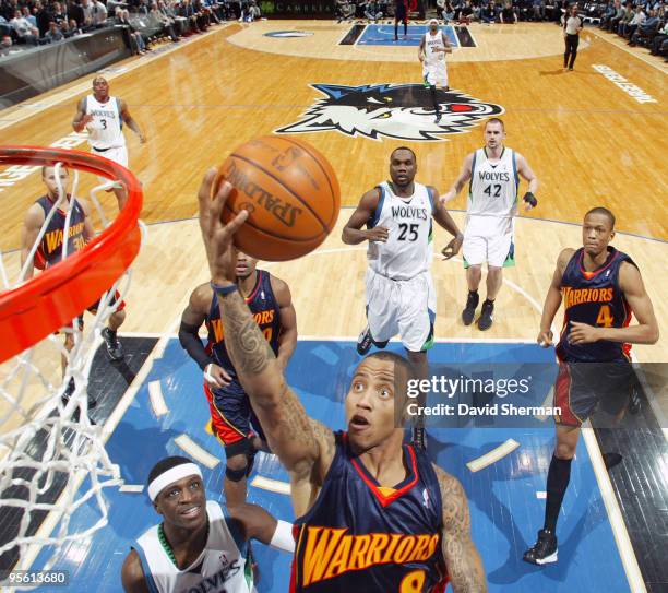 Monta Ellis of the Golden State Warriors takes the ball to the basket against Jonny Flynn of the Minnesota Timberwolves during the game on January 6,...