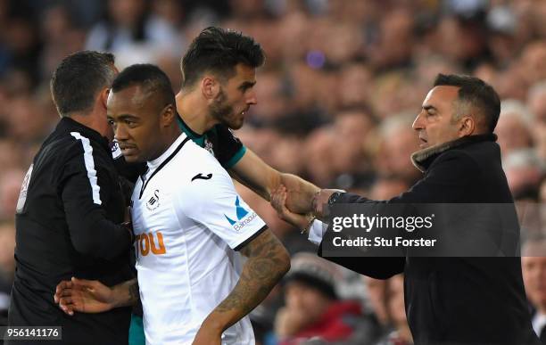 Wesley Hoedt of Southampton and Carlos Carvalhal, Manager of Swansea City clash during the Premier League match between Swansea City and Southampton...