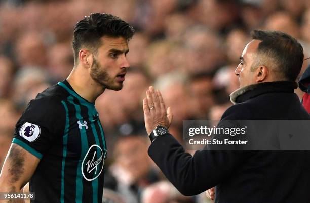 Wesley Hoedt of Southampton and Carlos Carvalhal, Manager of Swansea City clash during the Premier League match between Swansea City and Southampton...